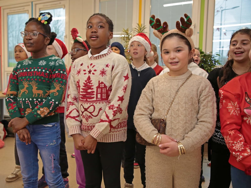 Caption: Students singing carols