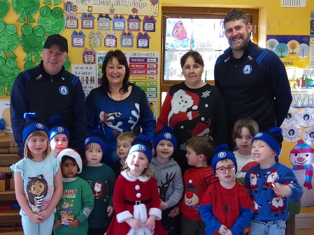 Caption: John Moran (Melview FC), Carol Shaw (Owner and manager Longford Montessori Centre), Anita McInerney and John Fitzpatrick (Melview FC) as the club brought hats and treats for all the boys and girls at Longford Montessori Centre.