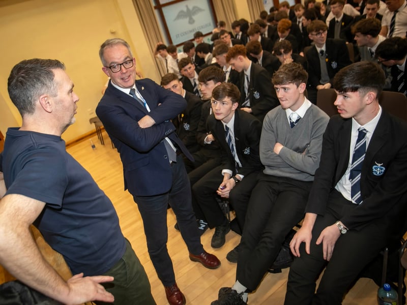 Mr. Tony McGonigle and Year 14 students in conversation with Oisin McConville at Wednesday's event in St. Columb's College.