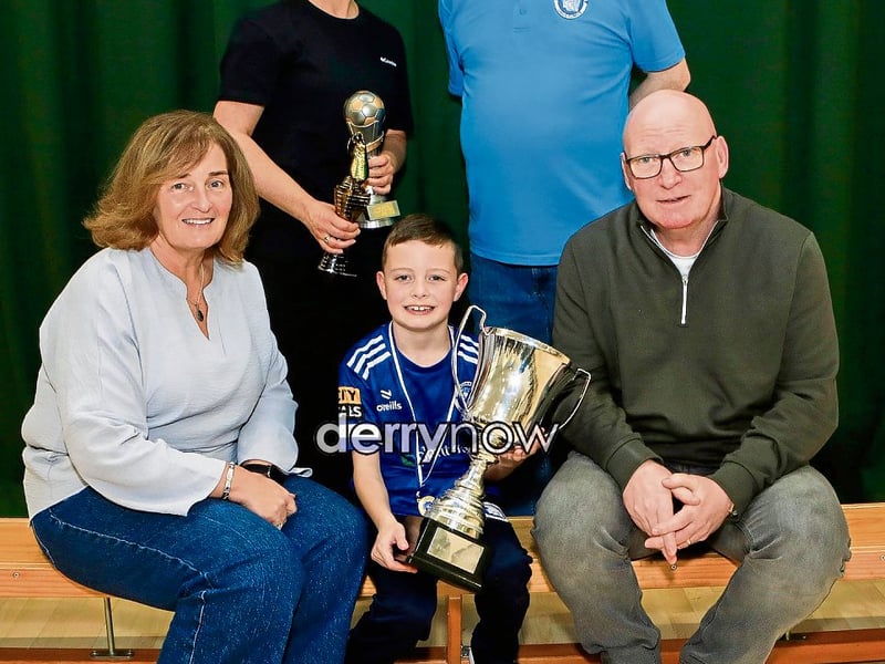 Charlie McCafferty awarded the Thomas Burke Award pictured with Linda and Thomas Burke. Also included is his mother Andrina and Trojans Raymond Carton.