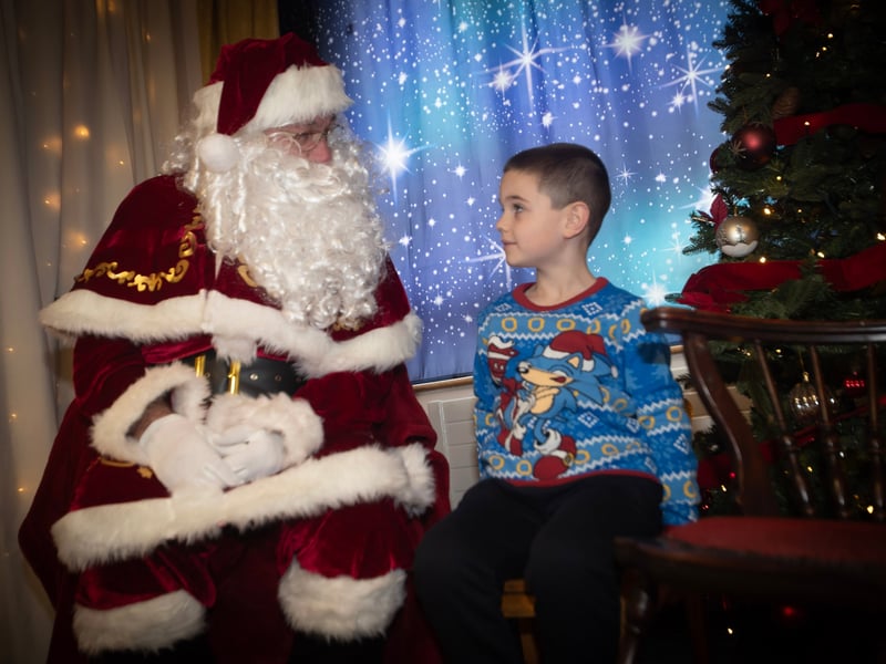 This young man getting his list to Santa Claus and collecting a present on Saturday at Derry Credit Union.