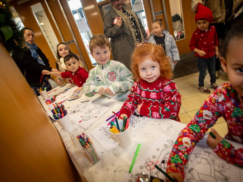 Some budding young artists show off their Santa Colouring Skills during Saturday's event at Derry Credit Union.