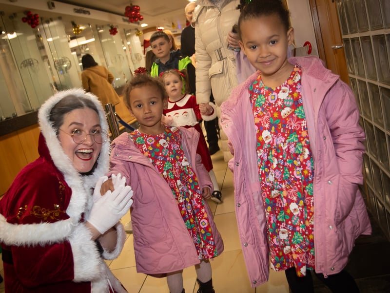 Mrs. Claus pictured with some of the children waiting to see Santa on Saturday.