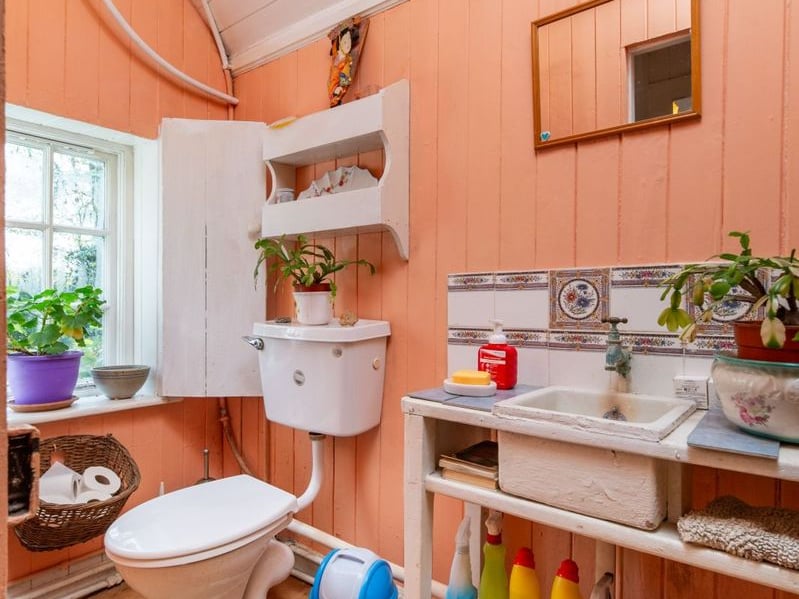 Like something out of The Secret Garden, a stunning period property built near Mountmellick by a historical figure has hit the market for €595,000. Set on 7.7 acres, The 200 year old Mill House promises stunning scenery, a gorgeous apple orchard, wildflower meadows and the ruins of the famous Mountmellick Mill. The Mill House, located in the townland of Drinagh, also known as New Mills, dates back to the early 1800s and carries a remarkable industrial heritage. The earliest records of New Mills appear in 1818, when Joseph Nevitt, noted in Quaker burial archives, resided here and later entered into partnership with John Millner. Together they established a thriving woollen manufacturing business, later expanding into a corn and saw mill. By the mid-1800s, the Millners’ enterprise was well known throughout the region, employing many locals and contributing to the area’s economic development. Elements of the original mill structures still remain on the property today, a lasting testament to the craftsmanship and industrious spirit of that era. Set on approximately 7.7 acres, The Mill House extends to c.214 m² and is surrounded by lavish, mature gardens, an orchard, wild meadow, and beautiful old trees, creating a sense of peace and privacy rarely found. The land is divided into four well-fenced paddocks, making it perfect for livestock or equestrian use thanks to its excellent security and layout. There is also a floodlit arena ideal for night-time riding out, offering superb convenience for horse owners. The current owners have lovingly preserved many of the original features, including stonework, arched brick detailing, and solid timber beams, showcasing the charm and authenticity of this extraordinary home. The accommodation consists of an entrance hall, kitchen cum dining room, living room, sitting room, home office, boot room, laundry, five bedrooms, main bathroom, and guest bathroom. Every room is filled with character, from exposed stone walls to original craftsmanship that reflects the history