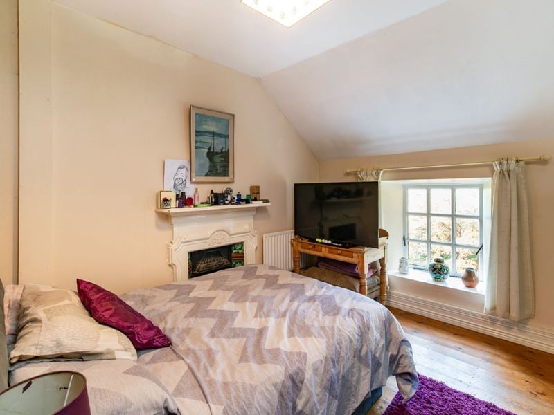 Like something out of The Secret Garden, a stunning period property built near Mountmellick by a historical figure has hit the market for €595,000. Set on 7.7 acres, The 200 year old Mill House promises stunning scenery, a gorgeous apple orchard, wildflower meadows and the ruins of the famous Mountmellick Mill. The Mill House, located in the townland of Drinagh, also known as New Mills, dates back to the early 1800s and carries a remarkable industrial heritage. The earliest records of New Mills appear in 1818, when Joseph Nevitt, noted in Quaker burial archives, resided here and later entered into partnership with John Millner. Together they established a thriving woollen manufacturing business, later expanding into a corn and saw mill. By the mid-1800s, the Millners’ enterprise was well known throughout the region, employing many locals and contributing to the area’s economic development. Elements of the original mill structures still remain on the property today, a lasting testament to the craftsmanship and industrious spirit of that era. Set on approximately 7.7 acres, The Mill House extends to c.214 m² and is surrounded by lavish, mature gardens, an orchard, wild meadow, and beautiful old trees, creating a sense of peace and privacy rarely found. The land is divided into four well-fenced paddocks, making it perfect for livestock or equestrian use thanks to its excellent security and layout. There is also a floodlit arena ideal for night-time riding out, offering superb convenience for horse owners. The current owners have lovingly preserved many of the original features, including stonework, arched brick detailing, and solid timber beams, showcasing the charm and authenticity of this extraordinary home. The accommodation consists of an entrance hall, kitchen cum dining room, living room, sitting room, home office, boot room, laundry, five bedrooms, main bathroom, and guest bathroom. Every room is filled with character, from exposed stone walls to original craftsmanship that reflects the history