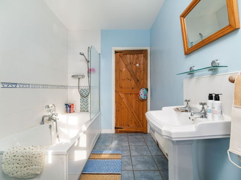 Like something out of The Secret Garden, a stunning period property built near Mountmellick by a historical figure has hit the market for €595,000. Set on 7.7 acres, The 200 year old Mill House promises stunning scenery, a gorgeous apple orchard, wildflower meadows and the ruins of the famous Mountmellick Mill. The Mill House, located in the townland of Drinagh, also known as New Mills, dates back to the early 1800s and carries a remarkable industrial heritage. The earliest records of New Mills appear in 1818, when Joseph Nevitt, noted in Quaker burial archives, resided here and later entered into partnership with John Millner. Together they established a thriving woollen manufacturing business, later expanding into a corn and saw mill. By the mid-1800s, the Millners’ enterprise was well known throughout the region, employing many locals and contributing to the area’s economic development. Elements of the original mill structures still remain on the property today, a lasting testament to the craftsmanship and industrious spirit of that era. Set on approximately 7.7 acres, The Mill House extends to c.214 m² and is surrounded by lavish, mature gardens, an orchard, wild meadow, and beautiful old trees, creating a sense of peace and privacy rarely found. The land is divided into four well-fenced paddocks, making it perfect for livestock or equestrian use thanks to its excellent security and layout. There is also a floodlit arena ideal for night-time riding out, offering superb convenience for horse owners. The current owners have lovingly preserved many of the original features, including stonework, arched brick detailing, and solid timber beams, showcasing the charm and authenticity of this extraordinary home. The accommodation consists of an entrance hall, kitchen cum dining room, living room, sitting room, home office, boot room, laundry, five bedrooms, main bathroom, and guest bathroom. Every room is filled with character, from exposed stone walls to original craftsmanship that reflects the history