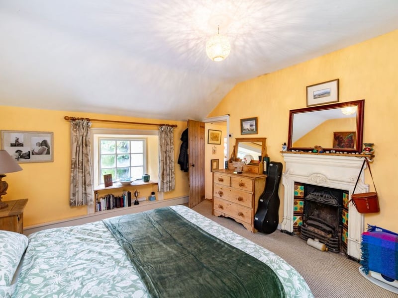 Like something out of The Secret Garden, a stunning period property built near Mountmellick by a historical figure has hit the market for €595,000. Set on 7.7 acres, The 200 year old Mill House promises stunning scenery, a gorgeous apple orchard, wildflower meadows and the ruins of the famous Mountmellick Mill. The Mill House, located in the townland of Drinagh, also known as New Mills, dates back to the early 1800s and carries a remarkable industrial heritage. The earliest records of New Mills appear in 1818, when Joseph Nevitt, noted in Quaker burial archives, resided here and later entered into partnership with John Millner. Together they established a thriving woollen manufacturing business, later expanding into a corn and saw mill. By the mid-1800s, the Millners’ enterprise was well known throughout the region, employing many locals and contributing to the area’s economic development. Elements of the original mill structures still remain on the property today, a lasting testament to the craftsmanship and industrious spirit of that era. Set on approximately 7.7 acres, The Mill House extends to c.214 m² and is surrounded by lavish, mature gardens, an orchard, wild meadow, and beautiful old trees, creating a sense of peace and privacy rarely found. The land is divided into four well-fenced paddocks, making it perfect for livestock or equestrian use thanks to its excellent security and layout. There is also a floodlit arena ideal for night-time riding out, offering superb convenience for horse owners. The current owners have lovingly preserved many of the original features, including stonework, arched brick detailing, and solid timber beams, showcasing the charm and authenticity of this extraordinary home. The accommodation consists of an entrance hall, kitchen cum dining room, living room, sitting room, home office, boot room, laundry, five bedrooms, main bathroom, and guest bathroom. Every room is filled with character, from exposed stone walls to original craftsmanship that reflects the history