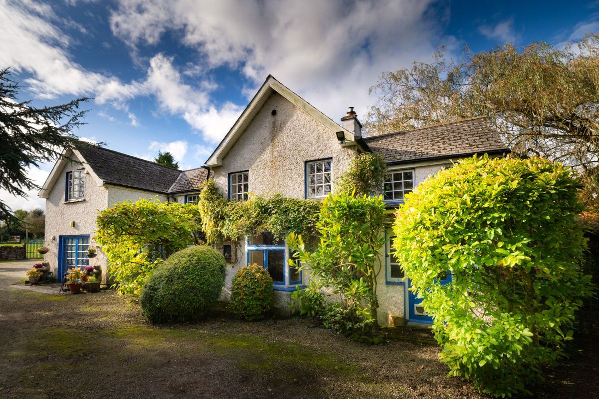 Like something out of The Secret Garden, a stunning period property built near Mountmellick by a historical figure has hit the market for €595,000. Set on 7.7 acres, The 200 year old Mill House promises stunning scenery, a gorgeous apple orchard, wildflower meadows and the ruins of the famous Mountmellick Mill. The Mill House, located in the townland of Drinagh, also known as New Mills, dates back to the early 1800s and carries a remarkable industrial heritage. The earliest records of New Mills appear in 1818, when Joseph Nevitt, noted in Quaker burial archives, resided here and later entered into partnership with John Millner. Together they established a thriving woollen manufacturing business, later expanding into a corn and saw mill. By the mid-1800s, the Millners’ enterprise was well known throughout the region, employing many locals and contributing to the area’s economic development. Elements of the original mill structures still remain on the property today, a lasting testament to the craftsmanship and industrious spirit of that era. Set on approximately 7.7 acres, The Mill House extends to c.214 m² and is surrounded by lavish, mature gardens, an orchard, wild meadow, and beautiful old trees, creating a sense of peace and privacy rarely found. The land is divided into four well-fenced paddocks, making it perfect for livestock or equestrian use thanks to its excellent security and layout. There is also a floodlit arena ideal for night-time riding out, offering superb convenience for horse owners. The current owners have lovingly preserved many of the original features, including stonework, arched brick detailing, and solid timber beams, showcasing the charm and authenticity of this extraordinary home. The accommodation consists of an entrance hall, kitchen cum dining room, living room, sitting room, home office, boot room, laundry, five bedrooms, main bathroom, and guest bathroom. Every room is filled with character, from exposed stone walls to original craftsmanship that reflects the history