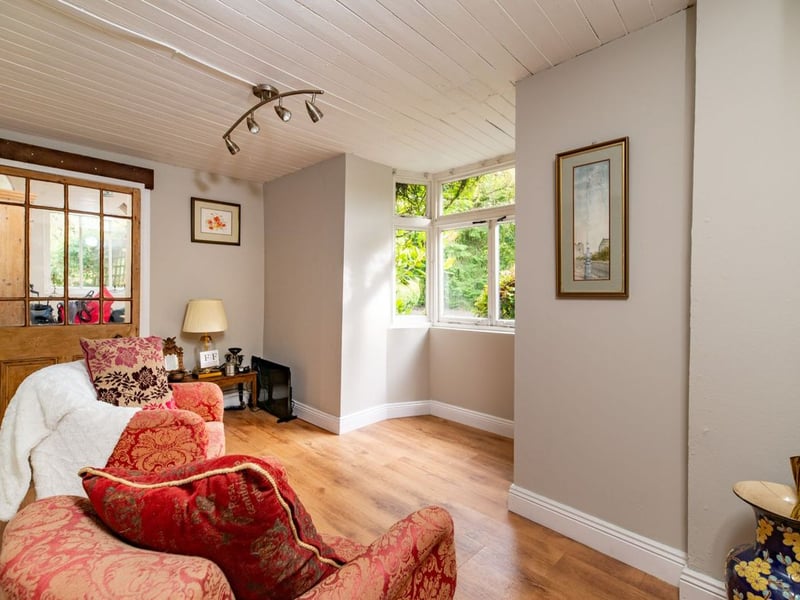 Like something out of The Secret Garden, a stunning period property built near Mountmellick by a historical figure has hit the market for €595,000. Set on 7.7 acres, The 200 year old Mill House promises stunning scenery, a gorgeous apple orchard, wildflower meadows and the ruins of the famous Mountmellick Mill. The Mill House, located in the townland of Drinagh, also known as New Mills, dates back to the early 1800s and carries a remarkable industrial heritage. The earliest records of New Mills appear in 1818, when Joseph Nevitt, noted in Quaker burial archives, resided here and later entered into partnership with John Millner. Together they established a thriving woollen manufacturing business, later expanding into a corn and saw mill. By the mid-1800s, the Millners’ enterprise was well known throughout the region, employing many locals and contributing to the area’s economic development. Elements of the original mill structures still remain on the property today, a lasting testament to the craftsmanship and industrious spirit of that era. Set on approximately 7.7 acres, The Mill House extends to c.214 m² and is surrounded by lavish, mature gardens, an orchard, wild meadow, and beautiful old trees, creating a sense of peace and privacy rarely found. The land is divided into four well-fenced paddocks, making it perfect for livestock or equestrian use thanks to its excellent security and layout. There is also a floodlit arena ideal for night-time riding out, offering superb convenience for horse owners. The current owners have lovingly preserved many of the original features, including stonework, arched brick detailing, and solid timber beams, showcasing the charm and authenticity of this extraordinary home. The accommodation consists of an entrance hall, kitchen cum dining room, living room, sitting room, home office, boot room, laundry, five bedrooms, main bathroom, and guest bathroom. Every room is filled with character, from exposed stone walls to original craftsmanship that reflects the history