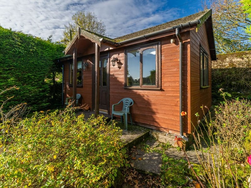 Like something out of The Secret Garden, a stunning period property built near Mountmellick by a historical figure has hit the market for €595,000. Set on 7.7 acres, The 200 year old Mill House promises stunning scenery, a gorgeous apple orchard, wildflower meadows and the ruins of the famous Mountmellick Mill. The Mill House, located in the townland of Drinagh, also known as New Mills, dates back to the early 1800s and carries a remarkable industrial heritage. The earliest records of New Mills appear in 1818, when Joseph Nevitt, noted in Quaker burial archives, resided here and later entered into partnership with John Millner. Together they established a thriving woollen manufacturing business, later expanding into a corn and saw mill. By the mid-1800s, the Millners’ enterprise was well known throughout the region, employing many locals and contributing to the area’s economic development. Elements of the original mill structures still remain on the property today, a lasting testament to the craftsmanship and industrious spirit of that era. Set on approximately 7.7 acres, The Mill House extends to c.214 m² and is surrounded by lavish, mature gardens, an orchard, wild meadow, and beautiful old trees, creating a sense of peace and privacy rarely found. The land is divided into four well-fenced paddocks, making it perfect for livestock or equestrian use thanks to its excellent security and layout. There is also a floodlit arena ideal for night-time riding out, offering superb convenience for horse owners. The current owners have lovingly preserved many of the original features, including stonework, arched brick detailing, and solid timber beams, showcasing the charm and authenticity of this extraordinary home. The accommodation consists of an entrance hall, kitchen cum dining room, living room, sitting room, home office, boot room, laundry, five bedrooms, main bathroom, and guest bathroom. Every room is filled with character, from exposed stone walls to original craftsmanship that reflects the history