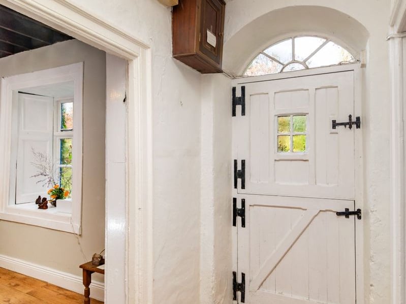 Like something out of The Secret Garden, a stunning period property built near Mountmellick by a historical figure has hit the market for €595,000. Set on 7.7 acres, The 200 year old Mill House promises stunning scenery, a gorgeous apple orchard, wildflower meadows and the ruins of the famous Mountmellick Mill. The Mill House, located in the townland of Drinagh, also known as New Mills, dates back to the early 1800s and carries a remarkable industrial heritage. The earliest records of New Mills appear in 1818, when Joseph Nevitt, noted in Quaker burial archives, resided here and later entered into partnership with John Millner. Together they established a thriving woollen manufacturing business, later expanding into a corn and saw mill. By the mid-1800s, the Millners’ enterprise was well known throughout the region, employing many locals and contributing to the area’s economic development. Elements of the original mill structures still remain on the property today, a lasting testament to the craftsmanship and industrious spirit of that era. Set on approximately 7.7 acres, The Mill House extends to c.214 m² and is surrounded by lavish, mature gardens, an orchard, wild meadow, and beautiful old trees, creating a sense of peace and privacy rarely found. The land is divided into four well-fenced paddocks, making it perfect for livestock or equestrian use thanks to its excellent security and layout. There is also a floodlit arena ideal for night-time riding out, offering superb convenience for horse owners. The current owners have lovingly preserved many of the original features, including stonework, arched brick detailing, and solid timber beams, showcasing the charm and authenticity of this extraordinary home. The accommodation consists of an entrance hall, kitchen cum dining room, living room, sitting room, home office, boot room, laundry, five bedrooms, main bathroom, and guest bathroom. Every room is filled with character, from exposed stone walls to original craftsmanship that reflects the history
