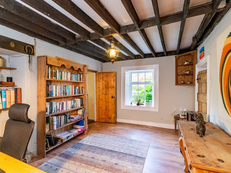 Like something out of The Secret Garden, a stunning period property built near Mountmellick by a historical figure has hit the market for €595,000. Set on 7.7 acres, The 200 year old Mill House promises stunning scenery, a gorgeous apple orchard, wildflower meadows and the ruins of the famous Mountmellick Mill. The Mill House, located in the townland of Drinagh, also known as New Mills, dates back to the early 1800s and carries a remarkable industrial heritage. The earliest records of New Mills appear in 1818, when Joseph Nevitt, noted in Quaker burial archives, resided here and later entered into partnership with John Millner. Together they established a thriving woollen manufacturing business, later expanding into a corn and saw mill. By the mid-1800s, the Millners’ enterprise was well known throughout the region, employing many locals and contributing to the area’s economic development. Elements of the original mill structures still remain on the property today, a lasting testament to the craftsmanship and industrious spirit of that era. Set on approximately 7.7 acres, The Mill House extends to c.214 m² and is surrounded by lavish, mature gardens, an orchard, wild meadow, and beautiful old trees, creating a sense of peace and privacy rarely found. The land is divided into four well-fenced paddocks, making it perfect for livestock or equestrian use thanks to its excellent security and layout. There is also a floodlit arena ideal for night-time riding out, offering superb convenience for horse owners. The current owners have lovingly preserved many of the original features, including stonework, arched brick detailing, and solid timber beams, showcasing the charm and authenticity of this extraordinary home. The accommodation consists of an entrance hall, kitchen cum dining room, living room, sitting room, home office, boot room, laundry, five bedrooms, main bathroom, and guest bathroom. Every room is filled with character, from exposed stone walls to original craftsmanship that reflects the history