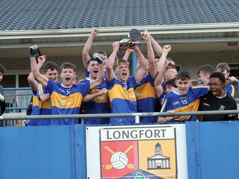 Caption: St Francis Dromard captain William McEntire lifts the cup with his team mates