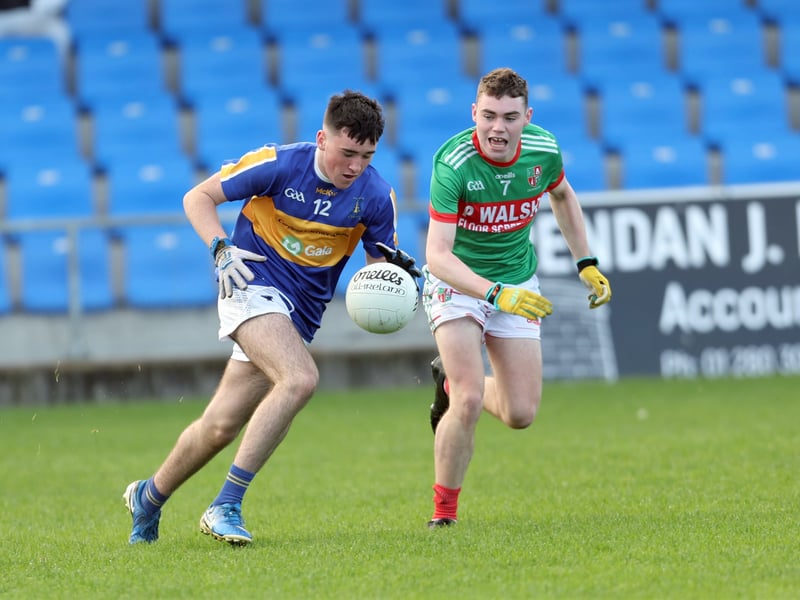 Caption: Oren McNreney (Dromard) tries to get past Jonah McKeon (Colmcille). Picture: Syl Healy