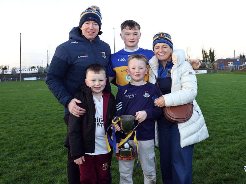 Caption: St Francis Dromard player Charlie Reilly with his family following the Glenn Brady Cup Final replay