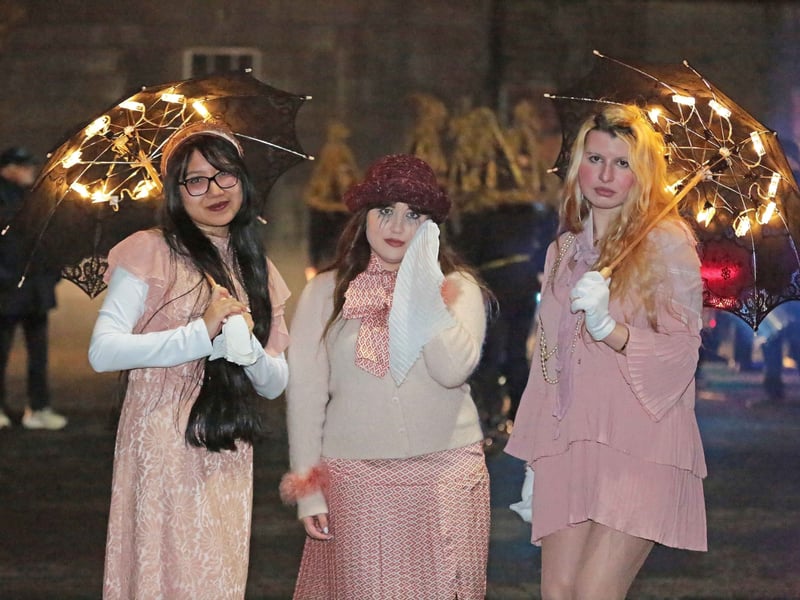 Caption: Backstage Youth Theatre members Margel Tuygon, Gemma Taffe and Ellie Quinn who participated in the spectacular Fire and Shadows Procession Picture: Shelley Corcoran