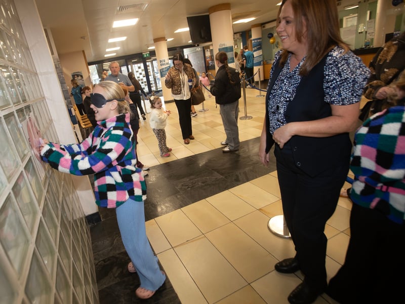 BULLSEYE!. . . . .Young Sophie Ward pins the pig during Saturday's International Credit Union Day celebrations at Abbey Street.