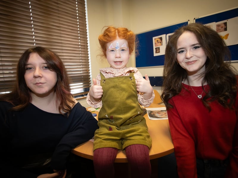 Facepainters Ellie McCourt and Lucy Harrigan pictured with 4 years old Ellen Quigley, delighted with her new face painting on Saturday at Derry Credit Union.