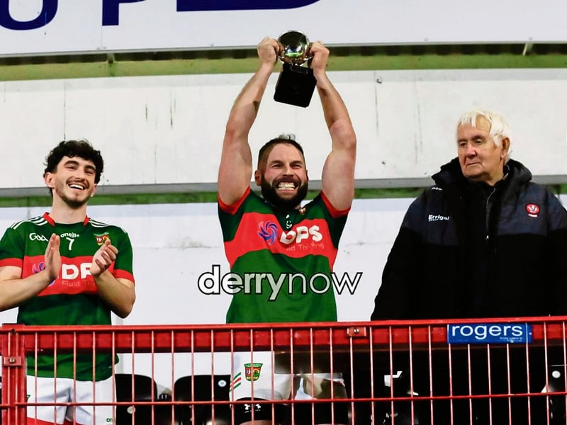 Slaughtmanus captain Jason Ferguson lifting the GAA GAA Junior Reserves Championship on Friday night.