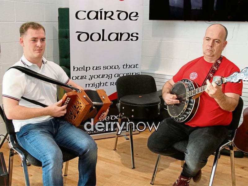 The musicians entertaining the crowd.
