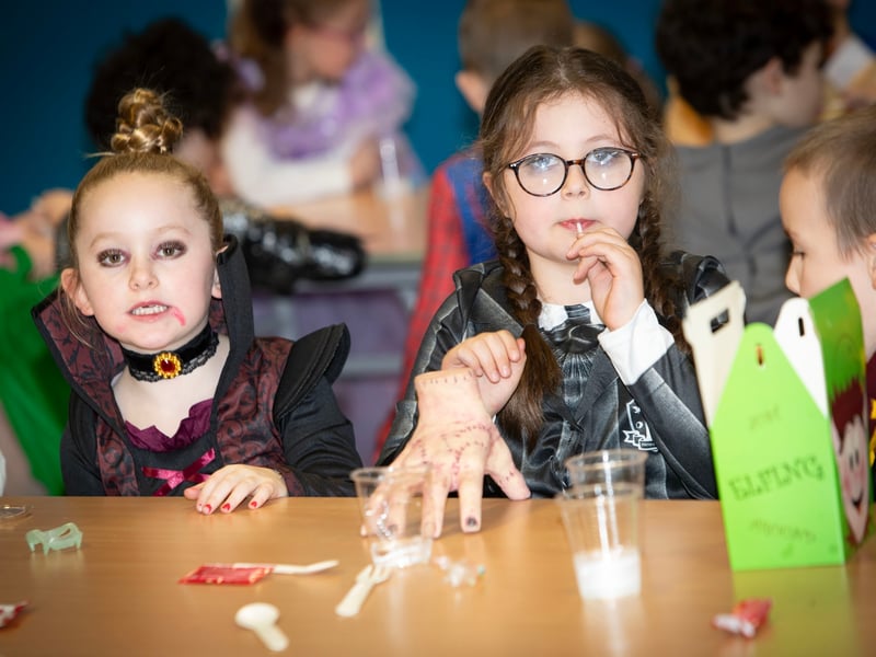 Two of the more colourful younger students pictured in the school canteen on Friday.