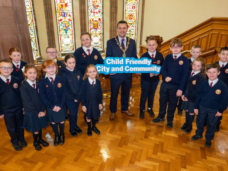 Pupils from Holy Child Primary School with the Mayor of Derry City and Strabane District Council, Councillor Ruairí McHugh.