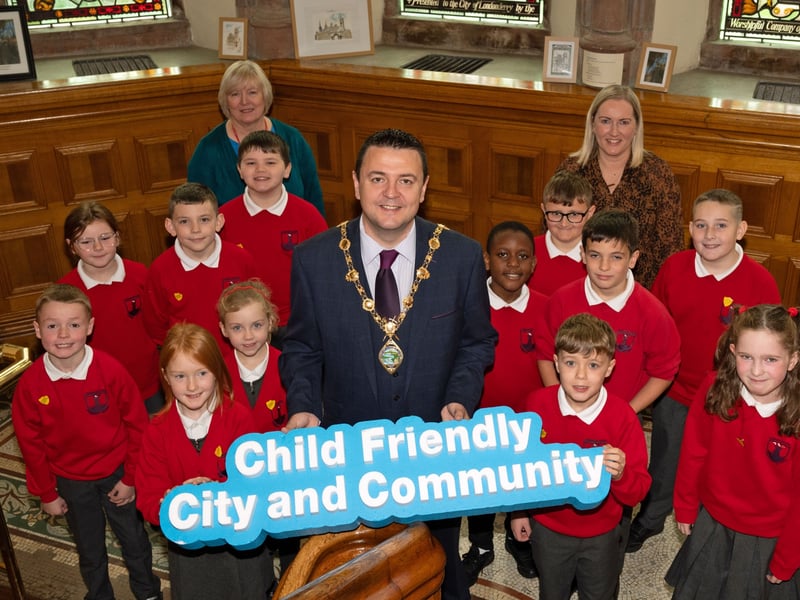 Mayor of Derry City and Strabane District Council, Councillor Ruairí McHugh pictured with over 200 Primary School pupils in the Guildhall where they discovered a range of interesting facts about the Mayor’s role.