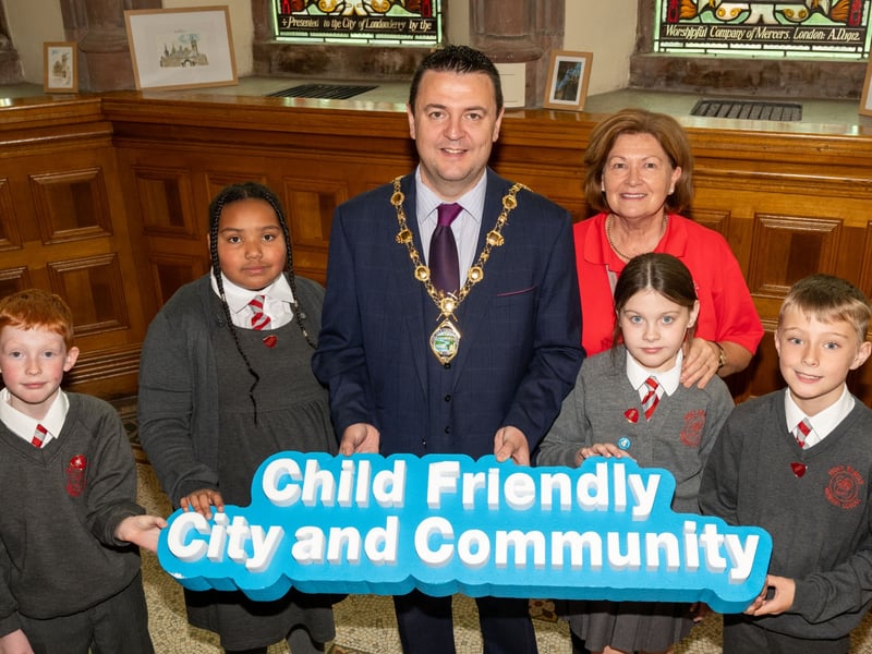 Pupils from Holy Family Primary School with the Mayor of Derry City and Strabane District Council, Councillor Ruairí McHugh.