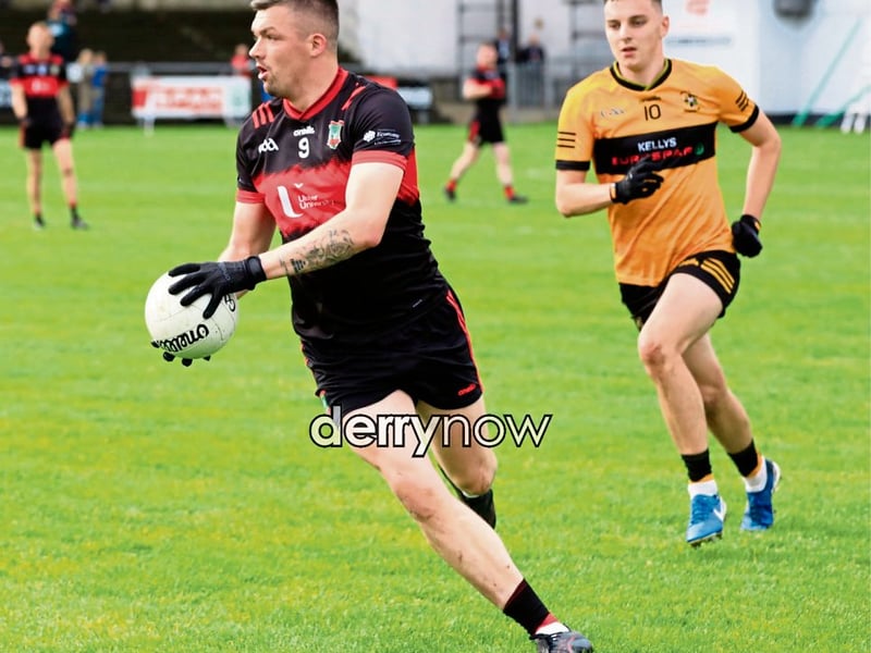 Sean Dolans Eamon McGinley prepares to kick the ball up the field in the Derry JFC quarter final against Moneymore.