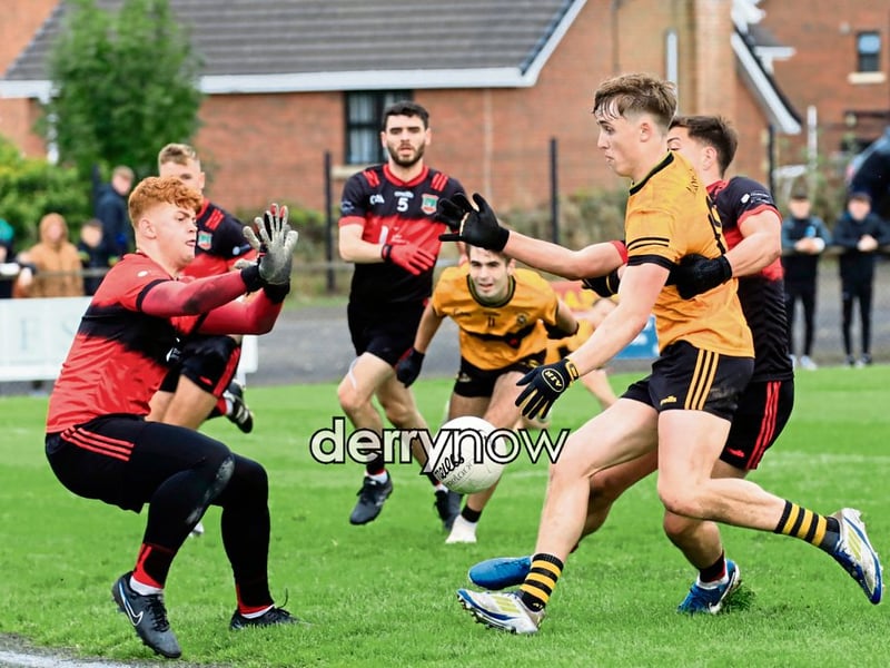Sean Dolans keeper Charlie Green tries in vain to save this ball from Ballymoney's Tiernan Kelly.