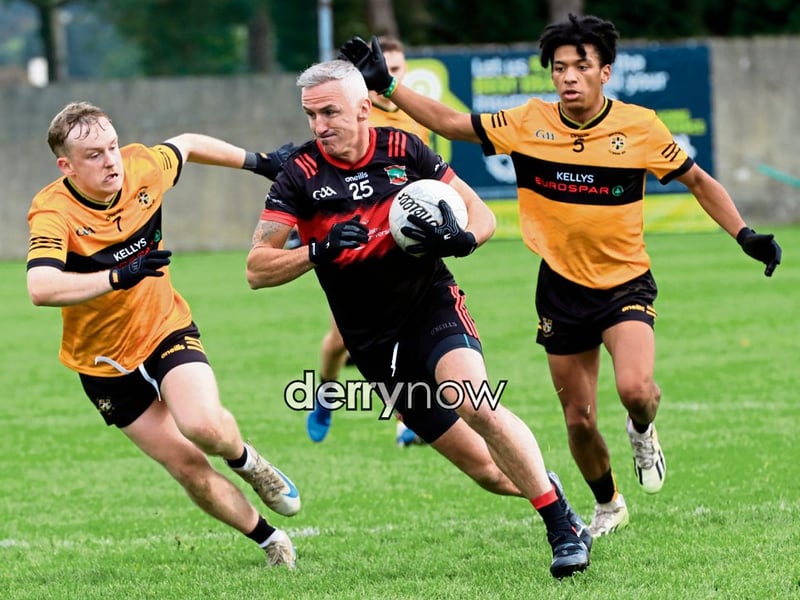 Sean Dolans Kevin Nixon powers forward with the ball.