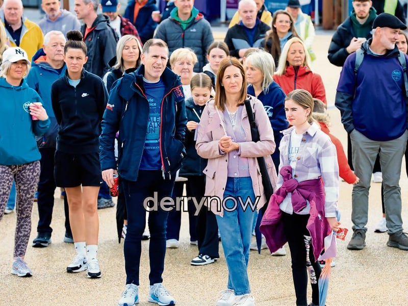 Crowds gather for a pre-walk talk.