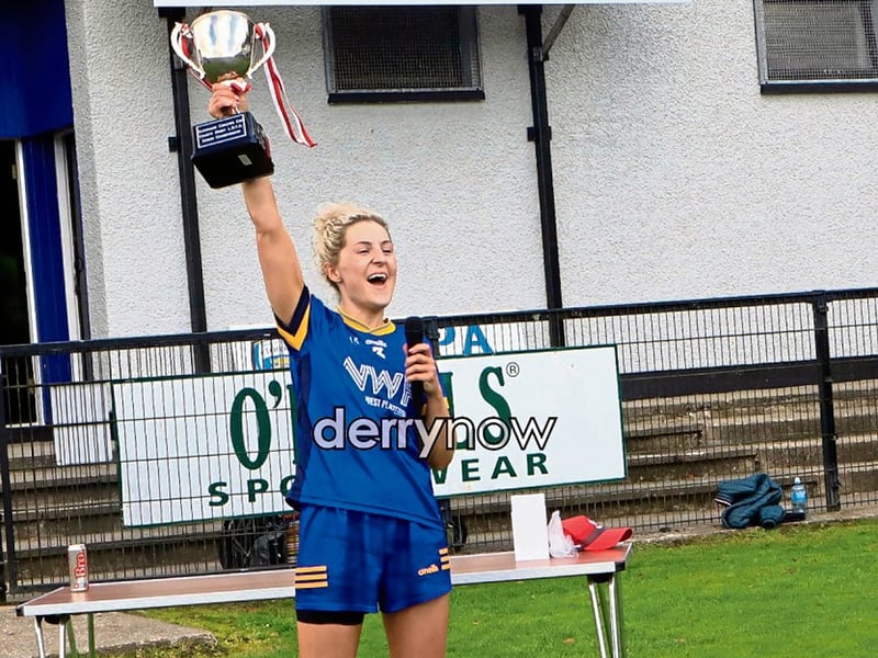 Steelstown's captain Aoife McGough lifts the cup in celebration.