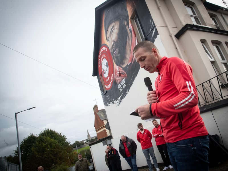 Ryan Horner, Tristar FC committee member, addressing the attendance at Saturday's Jon Clifford mural launch overlooking Bull Park in Derry.