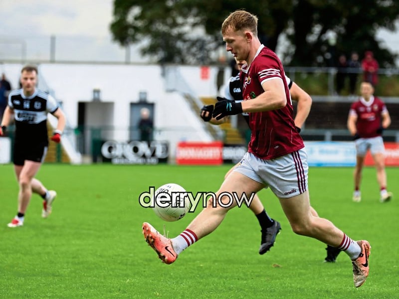 Banagher’s Tiarnan Moore solos the ball up the field.