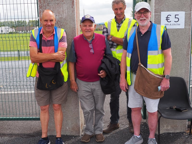 Fan Larkin with John Locke's officers John Walker (President), Jim Lynch (Chairperson), Paddy Kerwick (Treasurer) before the James Stephens and Dunnamaggin game at John Locke Park