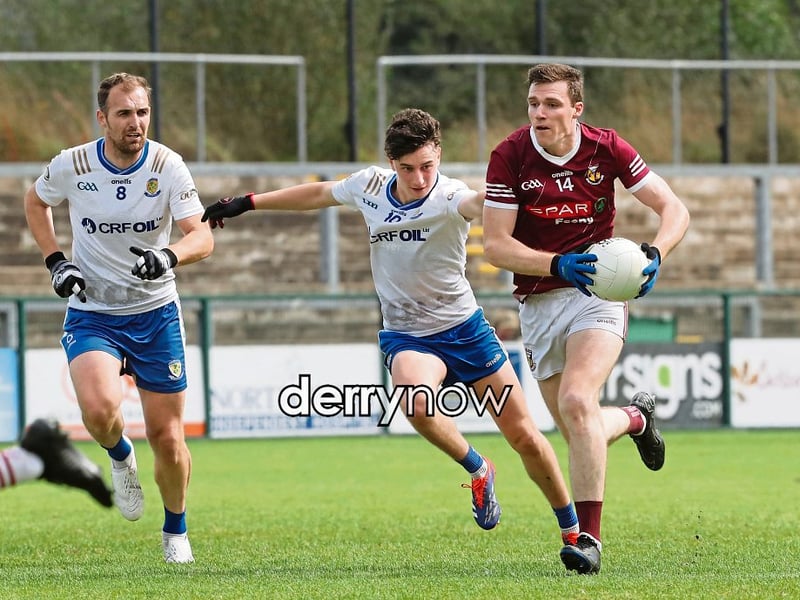 Banagher Brian McGilligan with Ryan Bell and Tiarnan Rocks of Ballinderry during the Derry SFC match at Owenbeg.