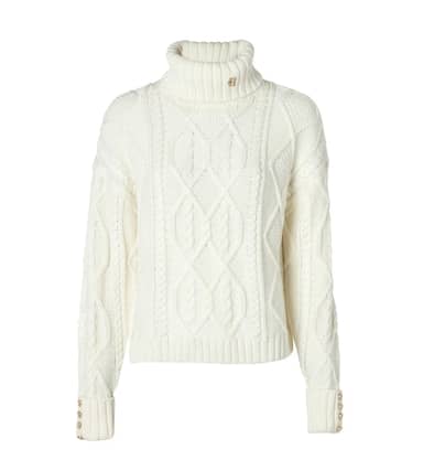 This means investing in longer, structured skirts, trousers and jackets that can easily transition from boardroom to bar drinks. Paired with cable knits, tartan and leather accents for edge – this trend evokes the Scottish highlands style a la Claudia Winkleman in The Traitors.