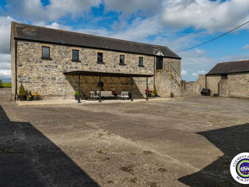 A stunning Georgian property has hit the market in Laois this week. The 19th century Cappakeel House in Emo could be yours, for a cool €1.2 million. Clement Herron Real Estate proudly presents Cappakeel House, a truly exceptional Georgian estate, dating back to circa 1820, situated just moments from the M7 motorway. A striking and private residence positioned on approximately 1.27 hectares (3.14 acres) of lush gardens and pasture, this is a home of rare charm, integrity, and scale. Approached via a tree-lined driveway, the main house immediately commands attention with its perfectly symmetrical Georgian façade, framed by landscaped lawns and mature specimen trees. The property offers the best of both worlds: a timeless period home in pristine condition with carefully preserved original features, and a remarkable opportunity for extensive residential development already granted by planning. The current accommodation spans two floors and includes a charming storm porch leading into an elegant entrance hallway with original Georgian tiled floors, high ceilings, and double doors into the main living spaces. The sitting room and formal dining room sit to either side, both bathed in natural light, feature fireplaces, and ornate coving still in place. To the rear of the house is the kitchen and dining area, a warm and inviting space that leads to a ground floor guest w.c. A standout feature of the home is the broad half-turn staircase which gracefully rises to the first floor. The landing offers a true sense of space and leads to four generously sized bedrooms, each full of character and light, along with the main bathroom, which retains the traditional elegance in keeping with the period style. The home is heated via oil-fired central heating and also benefits from a solid fuel stove for added comfort. The house is in excellent decorative order throughout, with a clear emphasis on preserving the architectural details of the Georgian period while maintaining everyday practicality. The internal spaces feel