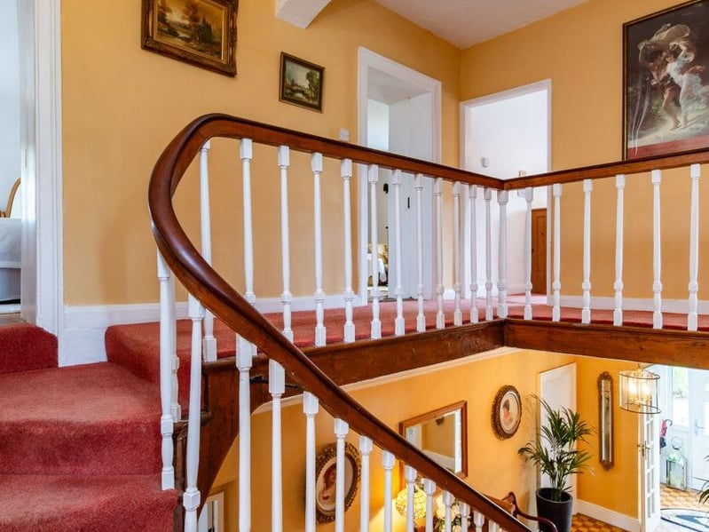A stunning Georgian property has hit the market in Laois this week. The 19th century Cappakeel House in Emo could be yours, for a cool €1.2 million. Clement Herron Real Estate proudly presents Cappakeel House, a truly exceptional Georgian estate, dating back to circa 1820, situated just moments from the M7 motorway. A striking and private residence positioned on approximately 1.27 hectares (3.14 acres) of lush gardens and pasture, this is a home of rare charm, integrity, and scale. Approached via a tree-lined driveway, the main house immediately commands attention with its perfectly symmetrical Georgian façade, framed by landscaped lawns and mature specimen trees. The property offers the best of both worlds: a timeless period home in pristine condition with carefully preserved original features, and a remarkable opportunity for extensive residential development already granted by planning. The current accommodation spans two floors and includes a charming storm porch leading into an elegant entrance hallway with original Georgian tiled floors, high ceilings, and double doors into the main living spaces. The sitting room and formal dining room sit to either side, both bathed in natural light, feature fireplaces, and ornate coving still in place. To the rear of the house is the kitchen and dining area, a warm and inviting space that leads to a ground floor guest w.c. A standout feature of the home is the broad half-turn staircase which gracefully rises to the first floor. The landing offers a true sense of space and leads to four generously sized bedrooms, each full of character and light, along with the main bathroom, which retains the traditional elegance in keeping with the period style. The home is heated via oil-fired central heating and also benefits from a solid fuel stove for added comfort. The house is in excellent decorative order throughout, with a clear emphasis on preserving the architectural details of the Georgian period while maintaining everyday practicality. The internal spaces feel