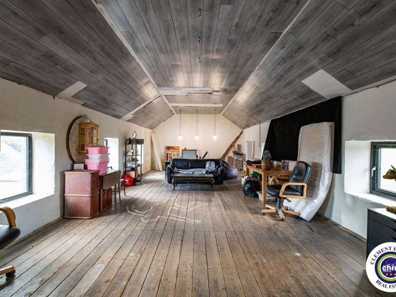 A stunning Georgian property has hit the market in Laois this week. The 19th century Cappakeel House in Emo could be yours, for a cool €1.2 million. Clement Herron Real Estate proudly presents Cappakeel House, a truly exceptional Georgian estate, dating back to circa 1820, situated just moments from the M7 motorway. A striking and private residence positioned on approximately 1.27 hectares (3.14 acres) of lush gardens and pasture, this is a home of rare charm, integrity, and scale. Approached via a tree-lined driveway, the main house immediately commands attention with its perfectly symmetrical Georgian façade, framed by landscaped lawns and mature specimen trees. The property offers the best of both worlds: a timeless period home in pristine condition with carefully preserved original features, and a remarkable opportunity for extensive residential development already granted by planning. The current accommodation spans two floors and includes a charming storm porch leading into an elegant entrance hallway with original Georgian tiled floors, high ceilings, and double doors into the main living spaces. The sitting room and formal dining room sit to either side, both bathed in natural light, feature fireplaces, and ornate coving still in place. To the rear of the house is the kitchen and dining area, a warm and inviting space that leads to a ground floor guest w.c. A standout feature of the home is the broad half-turn staircase which gracefully rises to the first floor. The landing offers a true sense of space and leads to four generously sized bedrooms, each full of character and light, along with the main bathroom, which retains the traditional elegance in keeping with the period style. The home is heated via oil-fired central heating and also benefits from a solid fuel stove for added comfort. The house is in excellent decorative order throughout, with a clear emphasis on preserving the architectural details of the Georgian period while maintaining everyday practicality. The internal spaces feel