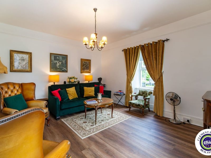 A stunning Georgian property has hit the market in Laois this week. The 19th century Cappakeel House in Emo could be yours, for a cool €1.2 million. Clement Herron Real Estate proudly presents Cappakeel House, a truly exceptional Georgian estate, dating back to circa 1820, situated just moments from the M7 motorway. A striking and private residence positioned on approximately 1.27 hectares (3.14 acres) of lush gardens and pasture, this is a home of rare charm, integrity, and scale. Approached via a tree-lined driveway, the main house immediately commands attention with its perfectly symmetrical Georgian façade, framed by landscaped lawns and mature specimen trees. The property offers the best of both worlds: a timeless period home in pristine condition with carefully preserved original features, and a remarkable opportunity for extensive residential development already granted by planning. The current accommodation spans two floors and includes a charming storm porch leading into an elegant entrance hallway with original Georgian tiled floors, high ceilings, and double doors into the main living spaces. The sitting room and formal dining room sit to either side, both bathed in natural light, feature fireplaces, and ornate coving still in place. To the rear of the house is the kitchen and dining area, a warm and inviting space that leads to a ground floor guest w.c. A standout feature of the home is the broad half-turn staircase which gracefully rises to the first floor. The landing offers a true sense of space and leads to four generously sized bedrooms, each full of character and light, along with the main bathroom, which retains the traditional elegance in keeping with the period style. The home is heated via oil-fired central heating and also benefits from a solid fuel stove for added comfort. The house is in excellent decorative order throughout, with a clear emphasis on preserving the architectural details of the Georgian period while maintaining everyday practicality. The internal spaces feel