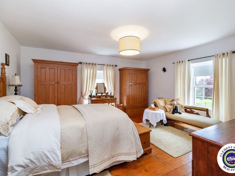 A stunning Georgian property has hit the market in Laois this week. The 19th century Cappakeel House in Emo could be yours, for a cool €1.2 million. Clement Herron Real Estate proudly presents Cappakeel House, a truly exceptional Georgian estate, dating back to circa 1820, situated just moments from the M7 motorway. A striking and private residence positioned on approximately 1.27 hectares (3.14 acres) of lush gardens and pasture, this is a home of rare charm, integrity, and scale. Approached via a tree-lined driveway, the main house immediately commands attention with its perfectly symmetrical Georgian façade, framed by landscaped lawns and mature specimen trees. The property offers the best of both worlds: a timeless period home in pristine condition with carefully preserved original features, and a remarkable opportunity for extensive residential development already granted by planning. The current accommodation spans two floors and includes a charming storm porch leading into an elegant entrance hallway with original Georgian tiled floors, high ceilings, and double doors into the main living spaces. The sitting room and formal dining room sit to either side, both bathed in natural light, feature fireplaces, and ornate coving still in place. To the rear of the house is the kitchen and dining area, a warm and inviting space that leads to a ground floor guest w.c. A standout feature of the home is the broad half-turn staircase which gracefully rises to the first floor. The landing offers a true sense of space and leads to four generously sized bedrooms, each full of character and light, along with the main bathroom, which retains the traditional elegance in keeping with the period style. The home is heated via oil-fired central heating and also benefits from a solid fuel stove for added comfort. The house is in excellent decorative order throughout, with a clear emphasis on preserving the architectural details of the Georgian period while maintaining everyday practicality. The internal spaces feel