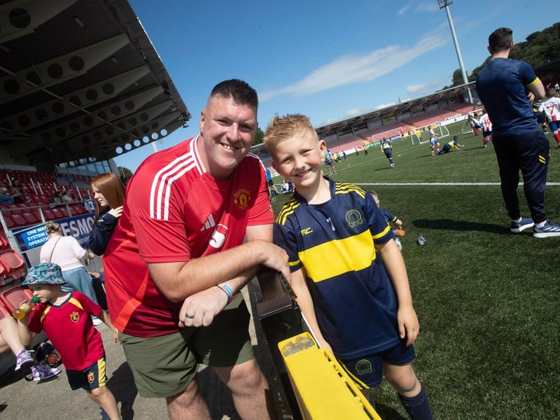 Northern Ireland darts player Daryl Gurney pictured at the Brandywell on Thursday with Daryl Junior, who was playing in the Ryan McBride Cup for Don Boscos.