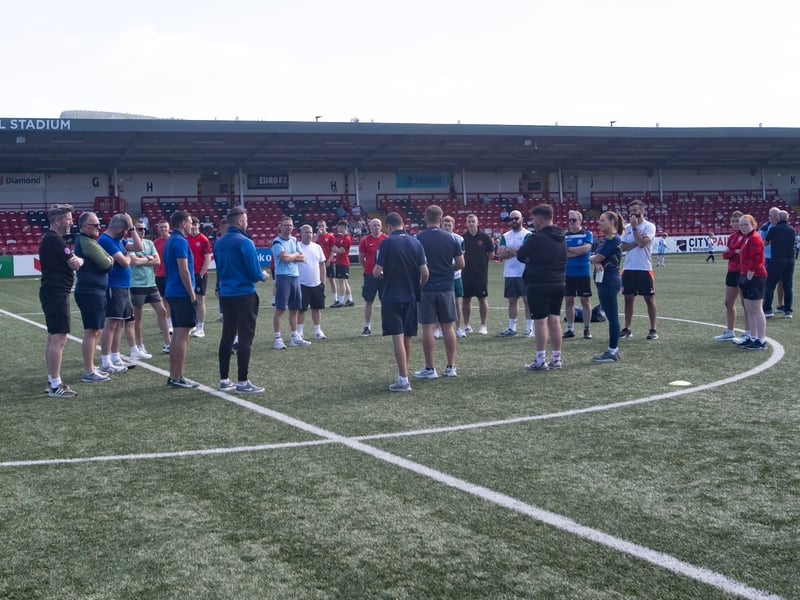 Managers, coaches and tournament organisers having a briefing before the start of Thursday's Feile 2025 Annual Ryan McBride Cup at the Brandywell.