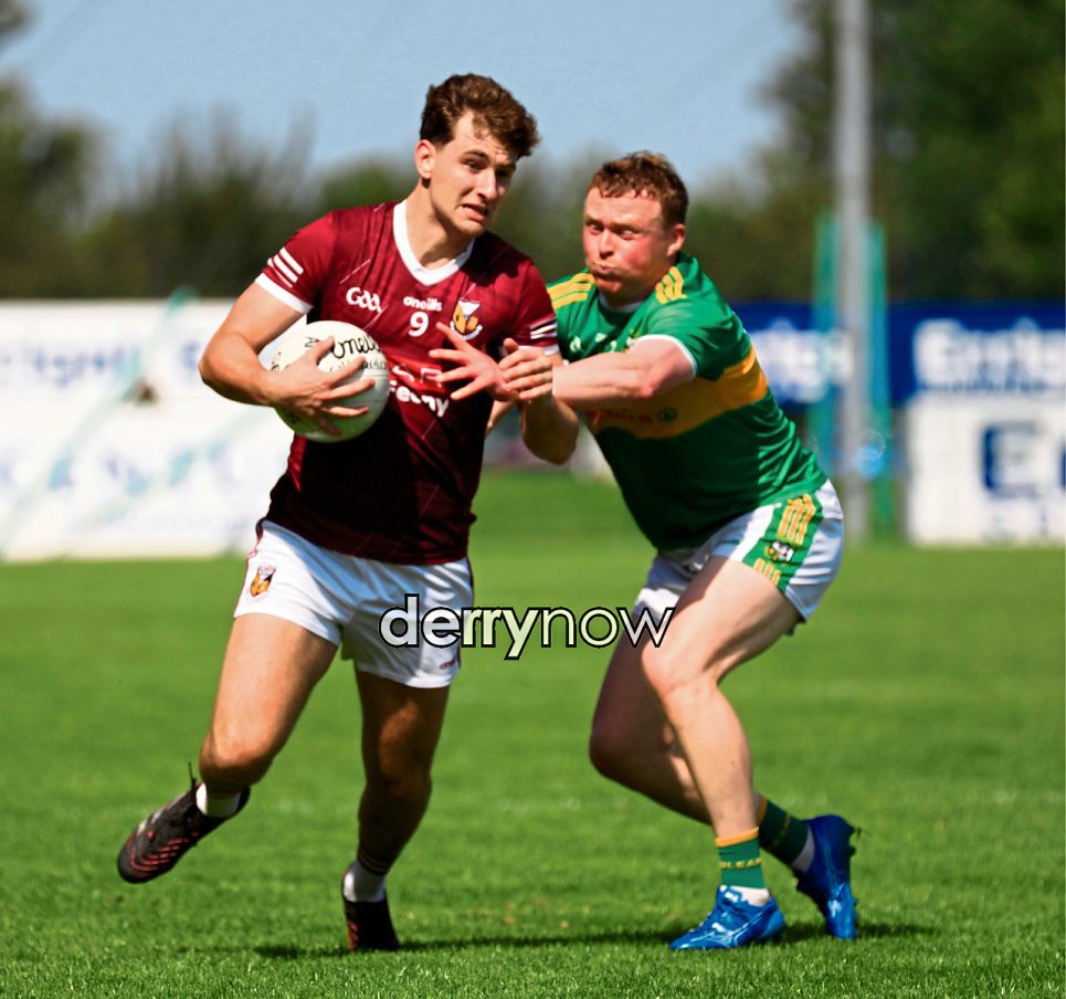 Banagher Callum O'Kane in a tussle with Glen Conor Convery. 