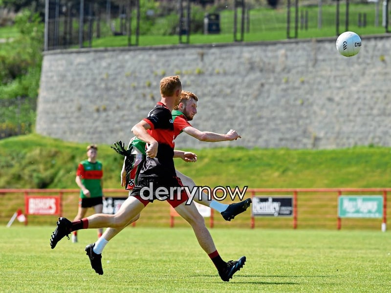 Doire Trasna’s Ryan Lindsay scores a point against Sean Dolans.