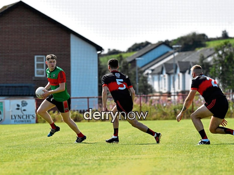 Conor McCosker and Ryan McCallion of Sean Dolans chase Doire Trasna’s Tom Casey.
