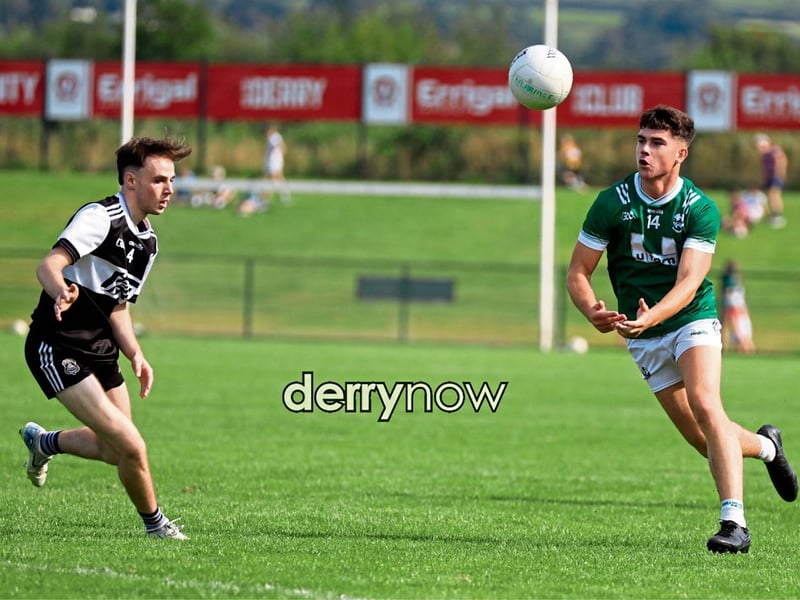 Newbridge's Callum McCrogan prepares to catch the ball as Dungiven's Niall McKeever moves.