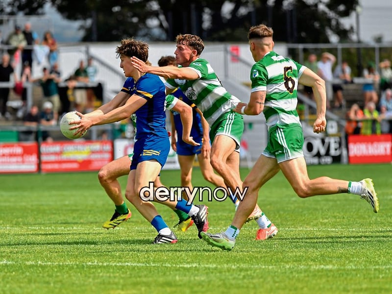 Steelstown’s Callum Derry is challenged by Kevin Martin of Faughanvale.